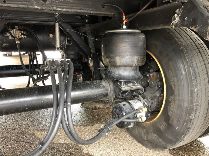 Technician performing a hydraulic line repair near Santa Maria, CA, for L Diesel Mobile Service